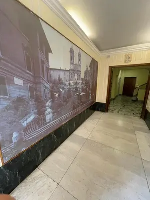 an empty hallway with a large painting on the wall at Casa Alessi in Rome elegant, spacious and comfortable apartment in Rome
