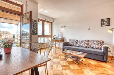 a living room with a couch and a table at Matilde's view apartment Saint Peter in Rome