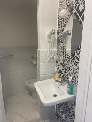 a bathroom with a sink and a toilet at Appartamento int 1 in Rome