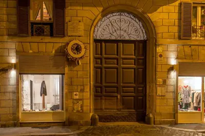 an entrance to a building with a large wooden door at Navona Gold Apartment in Rome