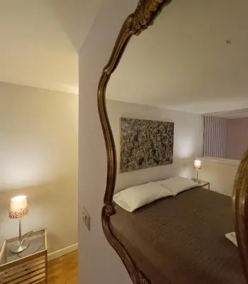 a bedroom with a large bed with a wooden frame at Navona Gold Apartment in Rome