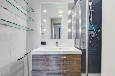a bathroom with a sink and a mirror at BMGA l Luxury 3Bdr Apt with Stunning View in City Center in Rome