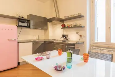 a kitchen with a table with glasses on it at iFlat Apê Ponte Sisto in Rome