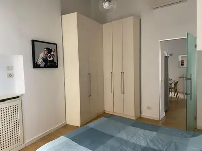 a room with white cabinets and a picture on the wall at Pantheon Design Apartment in Rome