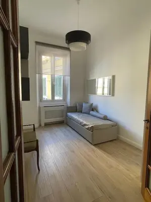 a living room with a couch in a room at Trastevere Design Apartment in Rome