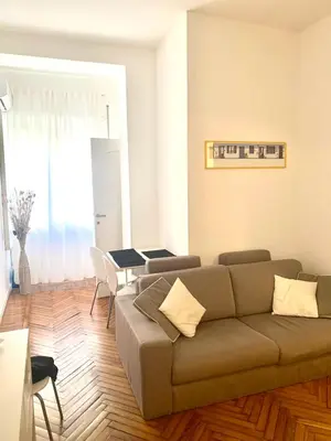 a living room with a couch and a table at Pariolina in Rome
