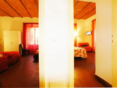 a room with a living room with a couch and a bed at The Artist House in Rome