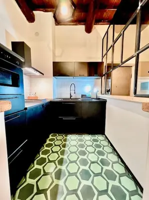 a kitchen with a sink and a kitchen floor at Appartamento nel cuore di Roma in Rome