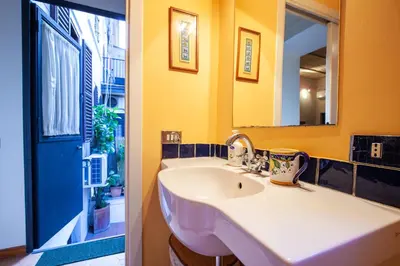a bathroom with a sink and a mirror at Il giardino di Bobo in Rome