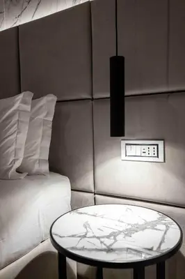 a room with a table next to a bed at Home at Rome Luxury Navona Guesthouse in Rome