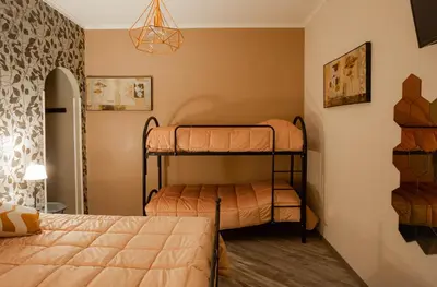 a bedroom with two bunk beds in a room at DOMUS PETRI- CASA A S. PIETRO in Rome