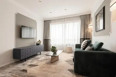 a living room with a couch and a tv at Be Mate Colosseo in Rome