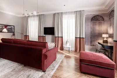a living room with a couch and a piano at Be Mate Piazza Navona in Rome
