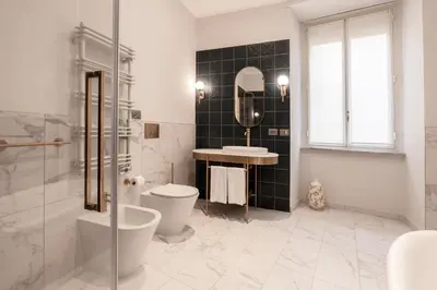 a bathroom with a shower and a toilet and a sink at Be Mate Castel Sant'Angelo in Rome