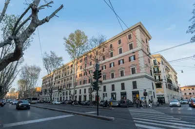 a busy city street with cars and buildings at Be Mate Trastevere II in Rome