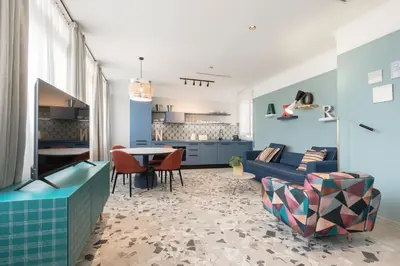 a living room with a couch and a table at Be Mate Trastevere III in Rome