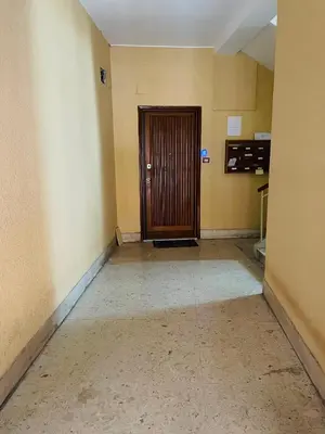 an empty hallway with a door in a room at Home Vatican Oasis in Rome