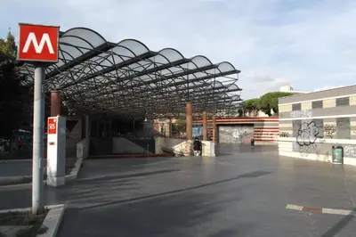 a large parking lot with a large metal roof at Vatican Walls Apartment in Rome