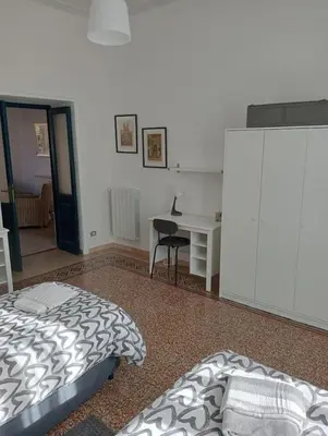 a bedroom with a bed and a desk at Breakfast at St Peter in Rome