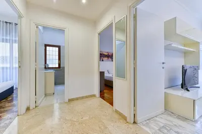 a bathroom with a shower and a toilet and a sink at Gold Apartment Monteverde-Gianicolense in Rome