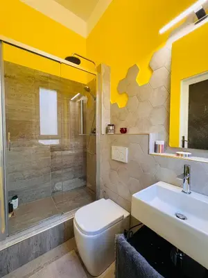 a bathroom with a toilet and a sink and a shower at Antonioni's Apartment Trastevere in Rome