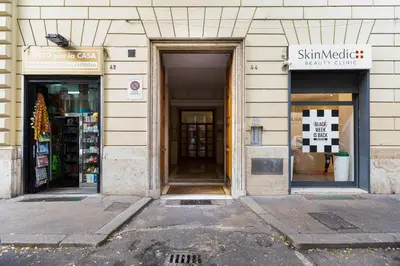 a building with two doors and a sign on it at Apt in the heart of the city in Rome