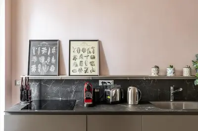 a kitchen counter with a sink and a counter top with a counter at iFlat The Monti Experience in Rome