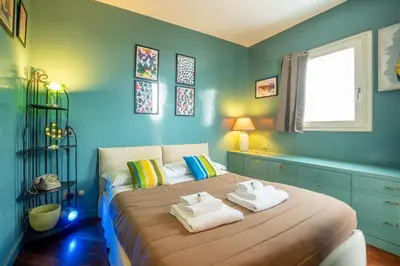 a bedroom with a bed with towels on it at Tiffany's apartment Flaminio in Rome