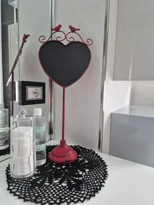 a bathroom counter with a heart holder on a table at Attico Cavour Prati, vicino Piazza Navona, Castel Sant'Angelo e San Pietro in Rome