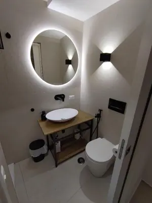 a bathroom with a toilet and a sink and a mirror at A CASA DEI ROMANI in Rome