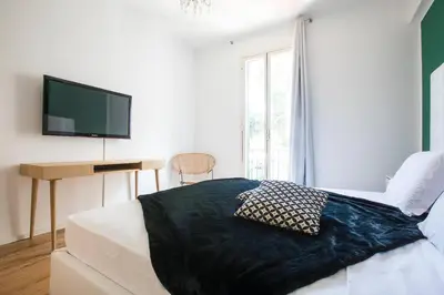 a bedroom with a bed with a black blanket at My Trastevere Three Bedroom View Apartment in Rome