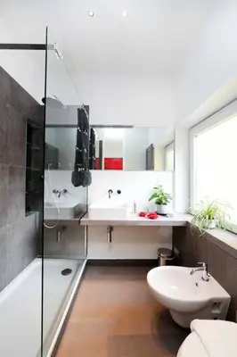 a bathroom with a tub and a sink and a toilet at Terrace Modern Studio Trastevere in Rome