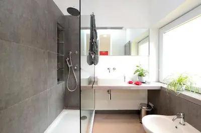 a bathroom with a sink and a shower at Terrace Modern Studio Trastevere in Rome
