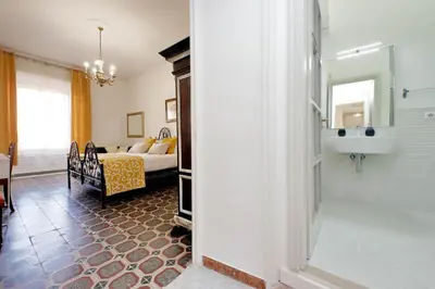 a room with a bedroom with a bed and a mirror at YCH-Luminoso appartamento per 8 pax in Rome