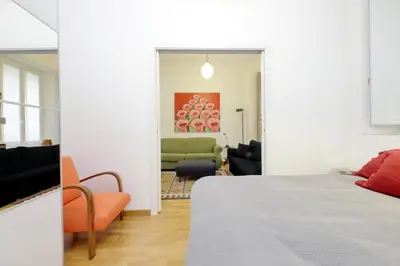 a bedroom with a bed and a living room at Laterano in Rome