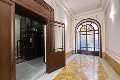 an empty room with a door and a window at DolceVitaSuite in Rome