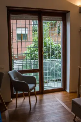 a room with a chair and a window at Traversari 27 in Rome