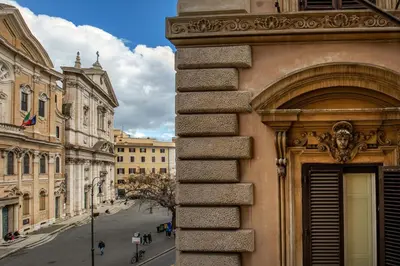 a building with an arch on the side of a street at Navona Sky Palace in Rome