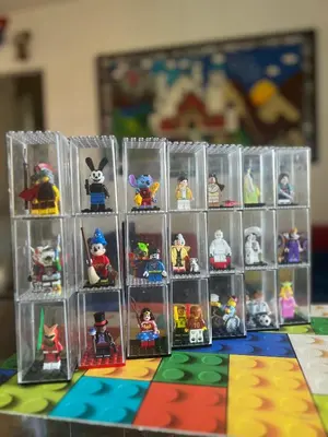 a group of toy figurines in plastic containers on a table at Cip's Brickhouse in Rome