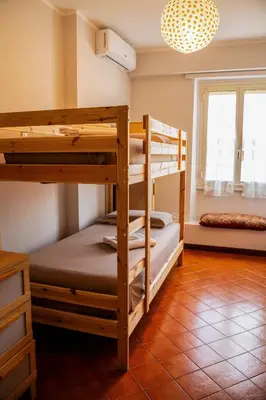 two bunk beds in a room with a window at Casa Marta in Rome