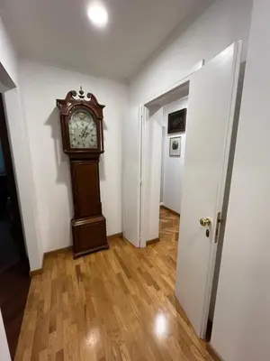 a hallway with a room with pictures on the walls at Torlonia Rooms in Rome