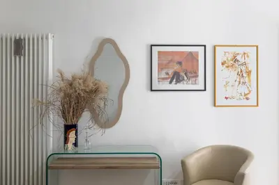 a table with a vase with a plant on it at iFlat Shiny Loft in Trastevere in Rome