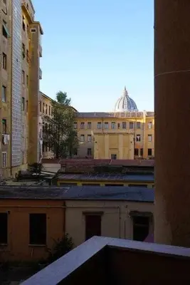 a view of a city with buildings and a dome at Rhome Holiday Fornaci in Rome