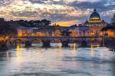 a view of a bridge over a river with a city at ETERNA Trastevere Apartment in Rome