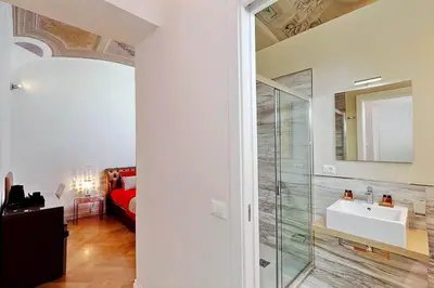 a bathroom with a glass shower and a sink at AMM Luxury Rooms in Rome