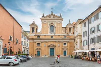 a building in a city with people walking in front at Lovely Nest by the Pantheon in Rome
