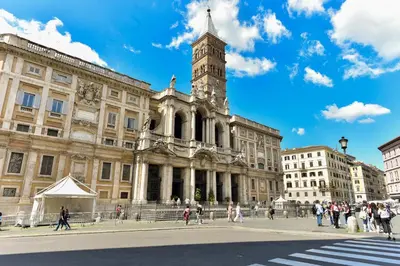 a large building with a clock tower on top of it at Paolina Boutique Apartment Monti in Rome