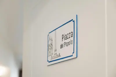 a framed picture on a wall with the words prairie the burro at Mater Rooms & Suites in Rome