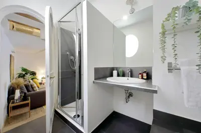 a bathroom with a shower and a sink at Fontanella Dream apartment in Rome