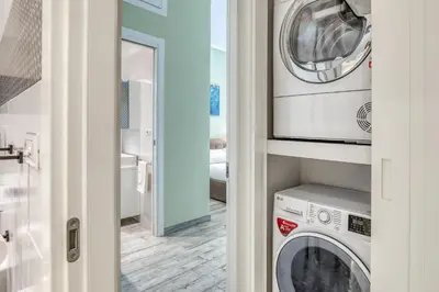 a laundry room with a washer and dryer in it at Re di Roma Apartment in Rome
